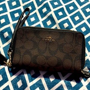 Monogrammed Coach mini wristlet used once but still in good condition